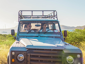 Couple driving jeep