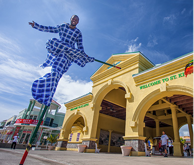 Caribbean Man on stilts at St. Kitts Welcome center