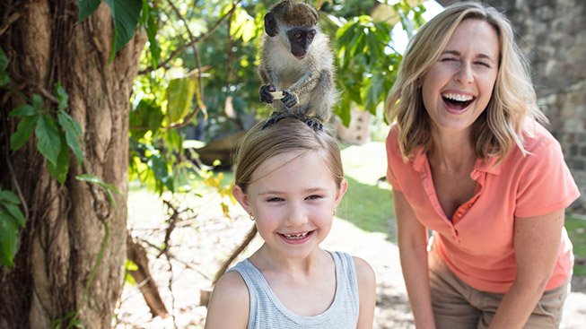 girl with monkey on the head