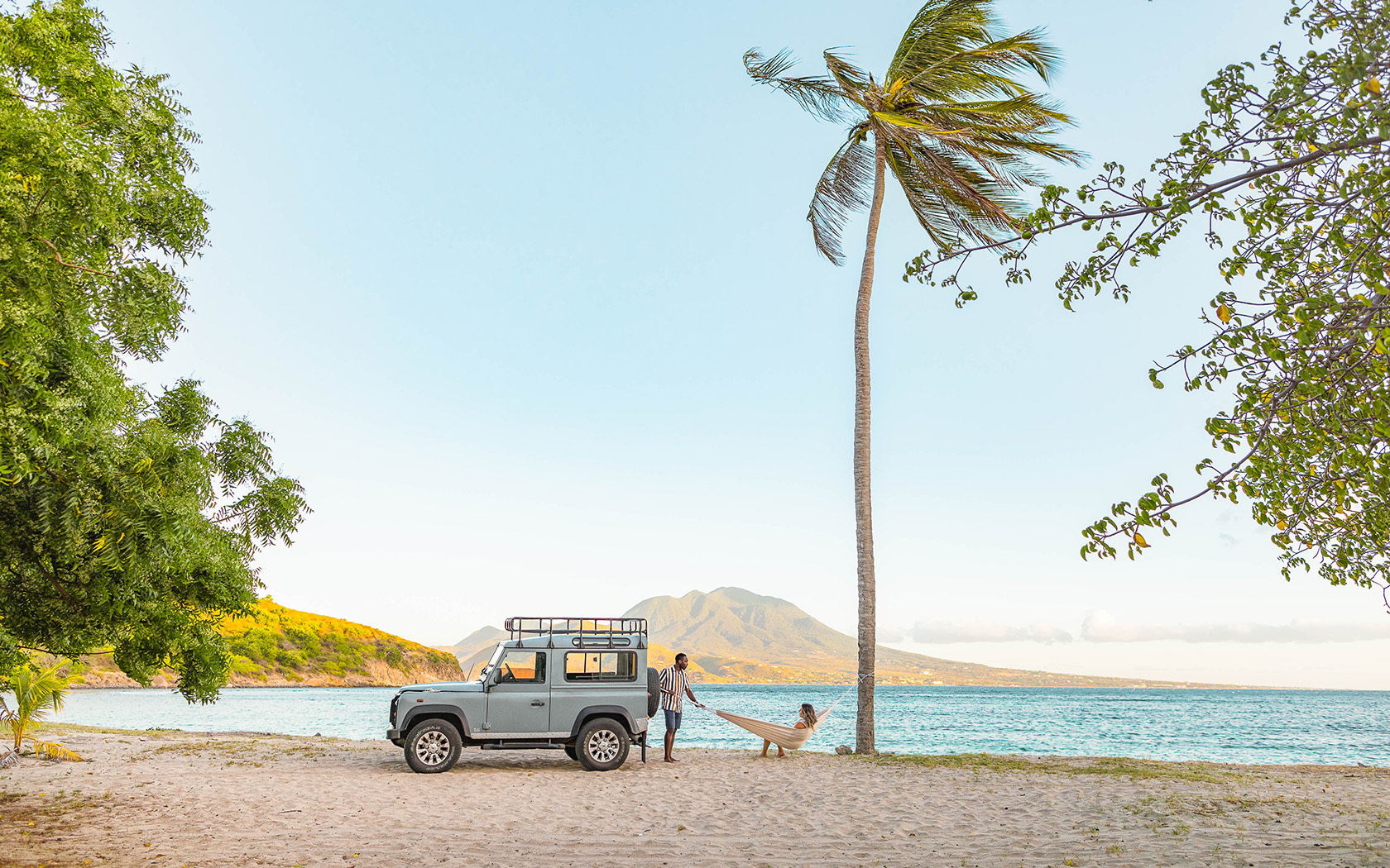couple and jeep on beach